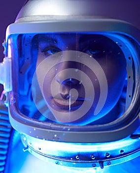 Close up shot of spacewoman in galaxy light