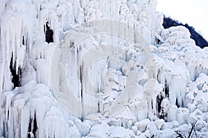 Close-up shot of a spectacular icefall in the mountain area. photo