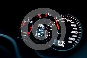 Close up shot of a speedometer in a car. Car dashboard. Dashboard details with indication lamps.Car instrument panel. Dashboard