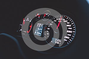 Close up shot of a speedometer in a car. Car dashboard. Dashboard details with indication lamps.Car instrument panel. Dashboard