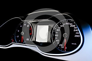 Close up shot of a speedometer in a car. Car dashboard. Dashboard details with indication lamps.Car instrument panel. Dashboard wi