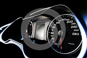 Close up shot of a speedometer in a car. Car dashboard. Dashboard details with indication lamps.Car instrument panel. Dashboard wi