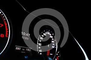 Close up shot of a speedometer in a car. Car dashboard. Dashboard details with indication lamps.Car instrument panel. Dashboard wi