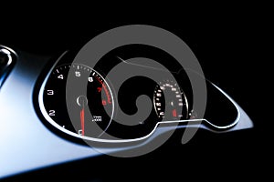 Close up shot of a speedometer in a car. Car dashboard. Dashboard details with indication lamps.Car instrument panel. Dashboard wi