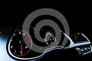 Close up shot of a speedometer in a car. Car dashboard. Dashboard details with indication lamps.Car instrument panel. Dashboard wi