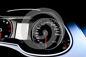 Close up shot of a speedometer in a car. Car dashboard. Dashboard details with indication lamps.Car instrument panel. Dashboard wi