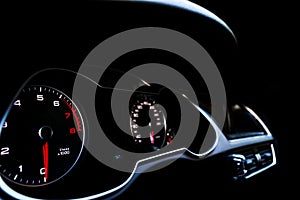 Close up shot of a speedometer in a car. Car dashboard. Dashboard details with indication lamps.Car instrument panel. Dashboard wi