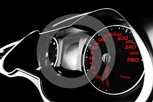 Close up shot of a speedometer in a car. Car dashboard. Dashboard details with indication lamps.Car instrument panel. Dashboard wi