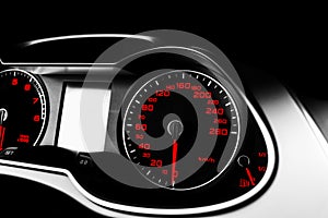 Close up shot of a speedometer in a car. Car dashboard. Dashboard details with indication lamps.Car instrument panel. Dashboard wi