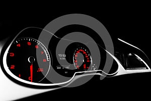 Close up shot of a speedometer in a car. Car dashboard. Dashboard details with indication lamps.Car instrument panel. Dashboard wi