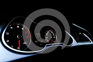 Close up shot of a speedometer in a car. Car dashboard. Dashboard details with indication lamps.Car instrument panel. Dashboard wi photo
