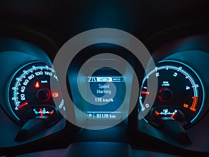 Close up shot of a speedometer and interior modern car console