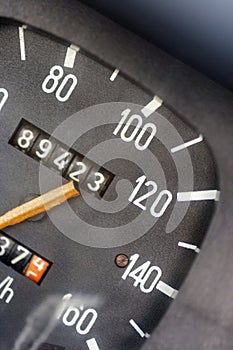 Close up shot of a speedometer in an old car