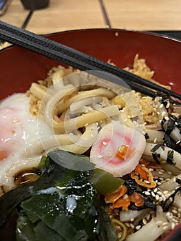 Close up shot of spicy shoyu udon with onsen egg