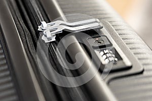 Close-up shot of a suitcase zipper locked in a digital lock