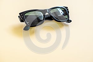 Close up shot of sunglasses shot against solid background