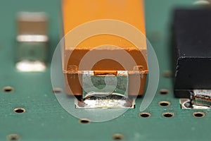 Tantalum capacitor on a printed circuit board photo