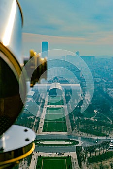 a close up of a telescope near a cityscape