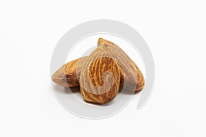 Close up shot of three roasted almonds