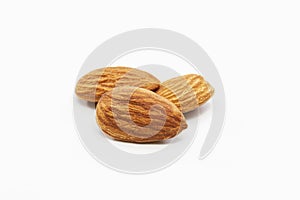 Close up shot of three roasted almonds