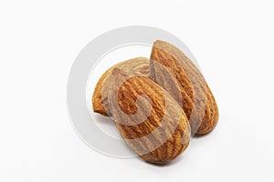 Close up shot of three roasted almonds