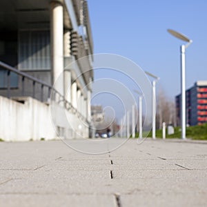 Close up shot of tiled pathway with blurry background