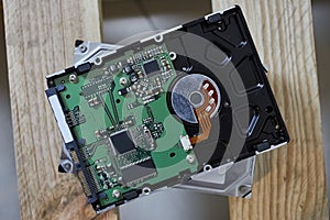 Close up shot to a hard disk drive on a wooden background