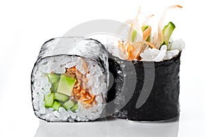 Close up shot of traditional fresh japanese sushi rolls on a white background. Vegetarian sushi roll