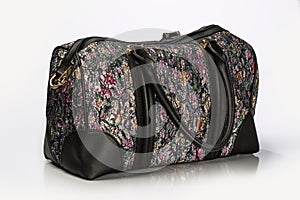 Close Up Shot Of A Unisex Duffle Bag With Multicolor Floral Pat