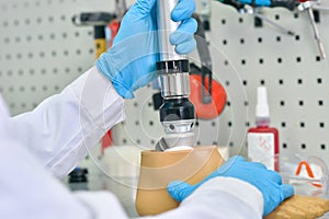 Prosthetist Assembling Artificial Leg Close Up