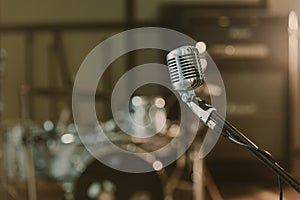 close-up shot of vintage microphone on stand against blurred