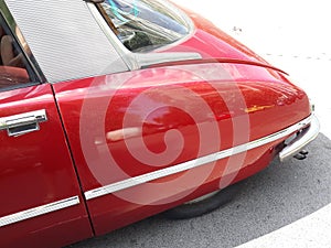 Close up shot of a vintage red car
