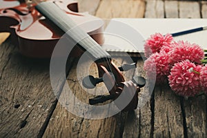 Close-up shot violin orchestra instrumental with vintage tone processed over wooden background select focus shallow depth of field