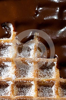 Close up shot of a waffle with chocolate