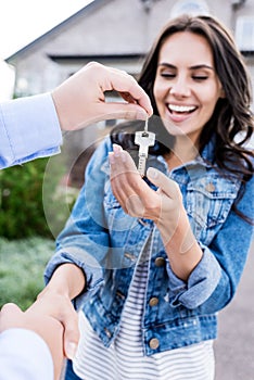 close-up shot of woman buying new house and shaking hands