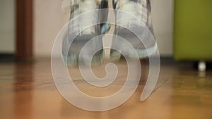 Close-up shot of woman jumping on a skipping rope in a gym. Sports concept