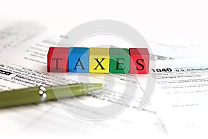 Close up shot of wooden blocks with colorful Taxes text