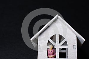 Close up shot of a wooden small white house figure - handcraft ideas