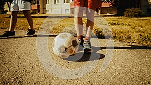 Close Up Shot : Young Boy Stopping a Ball with his Foot. Young Football Players Getting Ready to