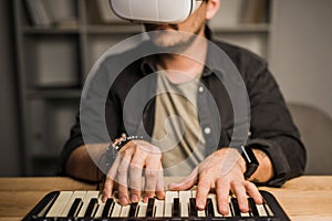 Man in vr goggles using MPC pad
