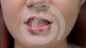 Close up shot of young women moves her lips talking with camera showing white straight healthy teeth, Lower part face detail of