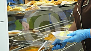 Close-up, showcase with dishes in modern Self service canteen, cafeteria, mess hall, factory employees having lunch in