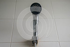 Close up shower head in bathroom