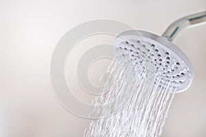 Close up of a Shower head with running water motion.