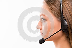 A close-up side-face portrait of a young agent of call centre