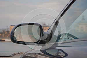 Close up of a side mirror on a car