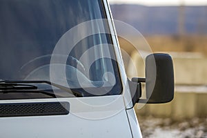 Close up of side rear-view mirror on a modern car