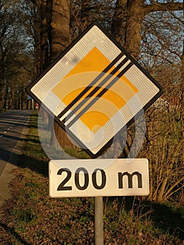 Close-up of sign indicating the end of priority road