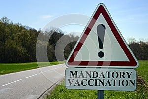 Road traffic sign indicating mandatory vaccination photo