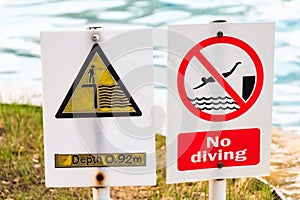 Close up of signs in swimmimg pool